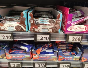Protein and collagen snack bars displayed on supermarket shelves