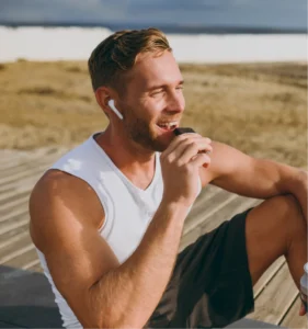 Man eating a protein chocolate bar outdoors after exercise